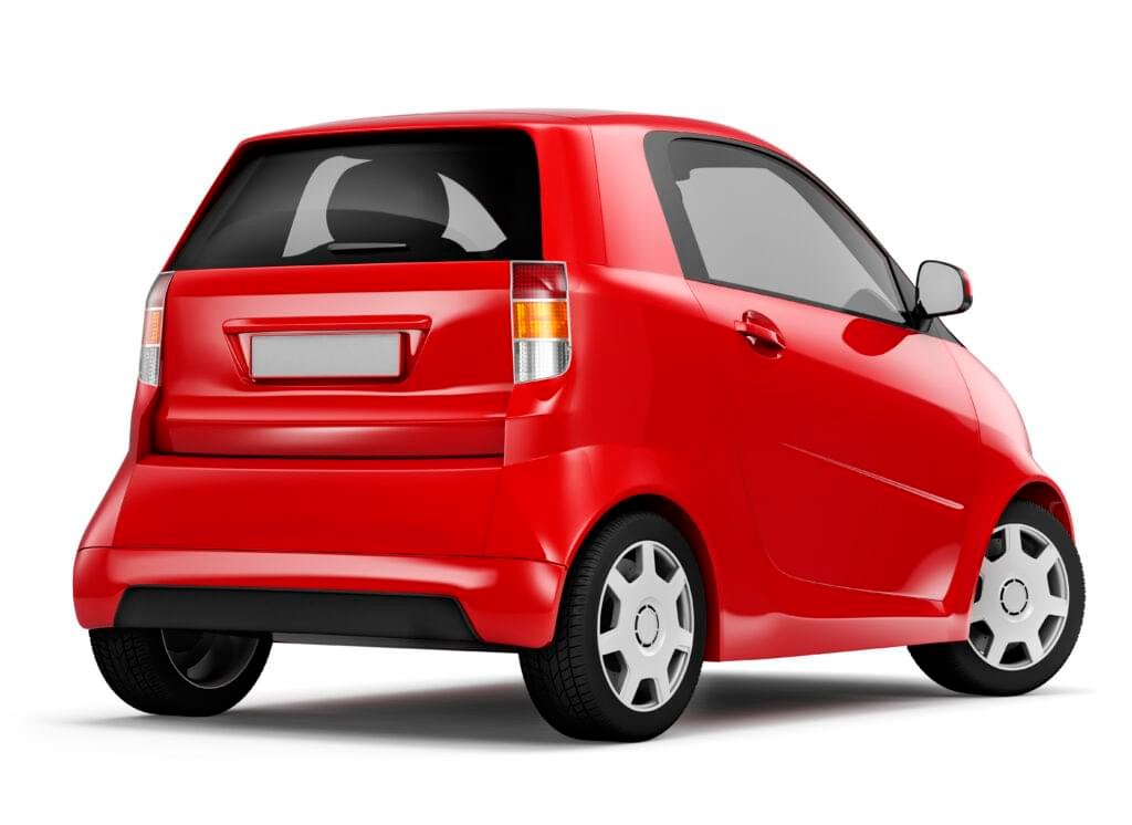 back view studio shot of red hybrid electric sedan car