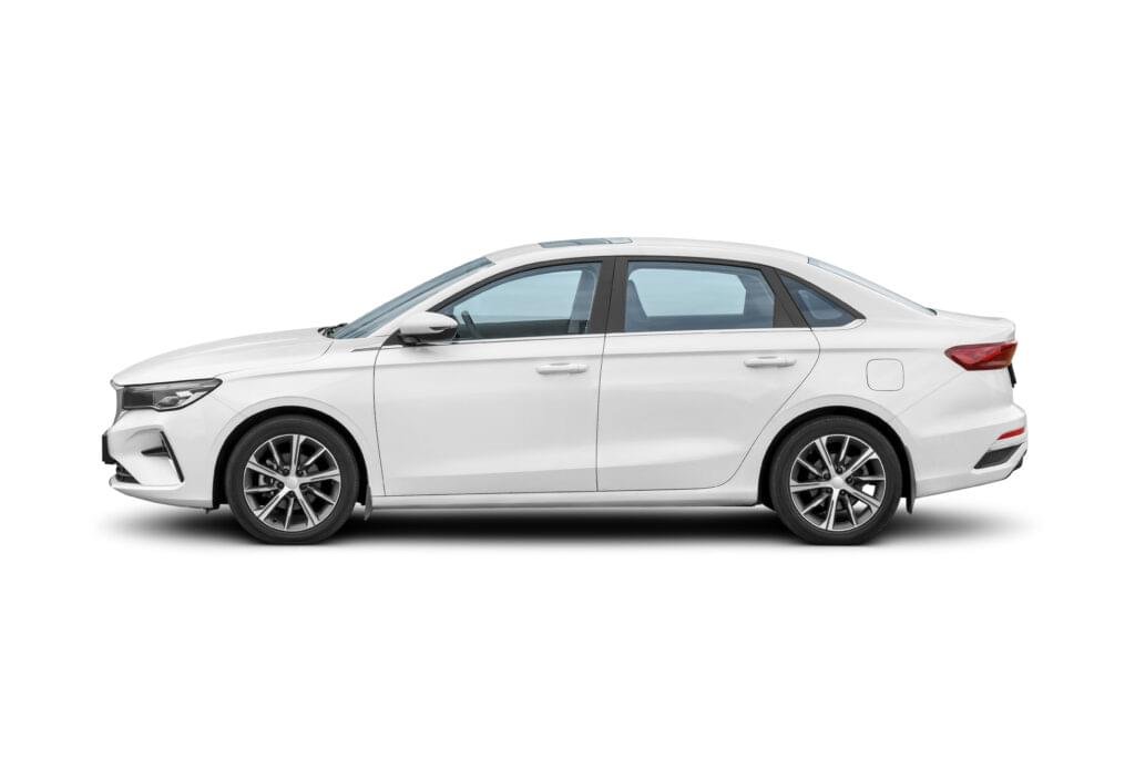 white compact car, small size passenger vehicle isolated on white. side view.